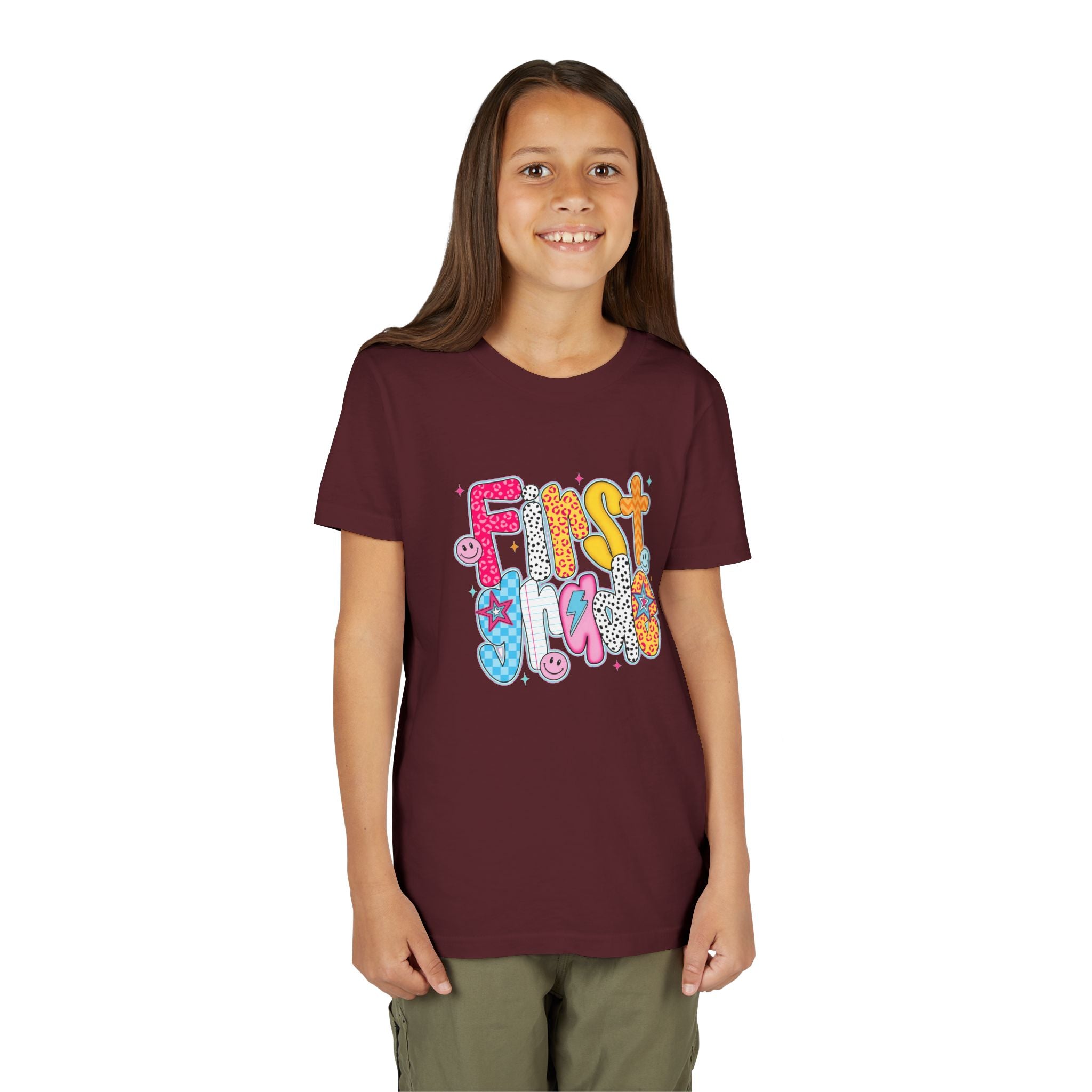 First Grade Youth Tee — Colorful Back-to-School Graphic Shirt